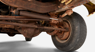 Close-up of rusted suspension and steering components of Classic Ford Bronco