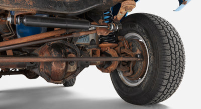 Close-up of the front right suspension and wheel of Classic Ford Bronco