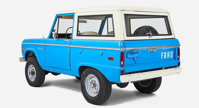 Classic Ford Bronco in blue with white roof viewed from rear right side