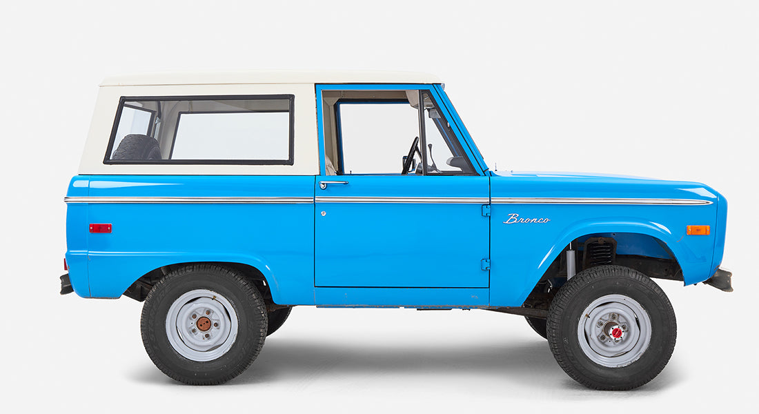 Side view of Classic Ford Bronco in blue with white roof