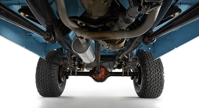 Underside view of Classic Ford Bronco showing exhaust system and tires