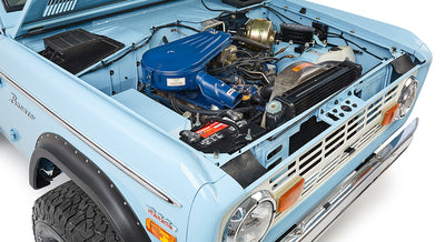 Classic Ford Bronco baby blue hood open showing engine and front grille