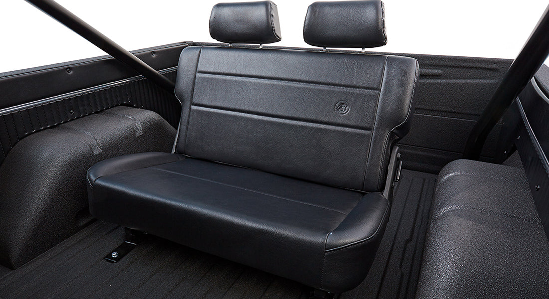 Black rear bench seat with headrests inside Classic Ford Bronco