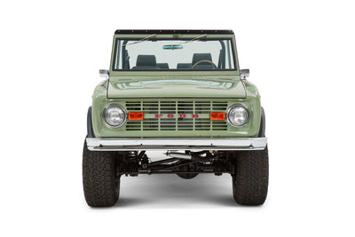 Classic Ford Bronco front view in green with chrome bumper and round headlights
