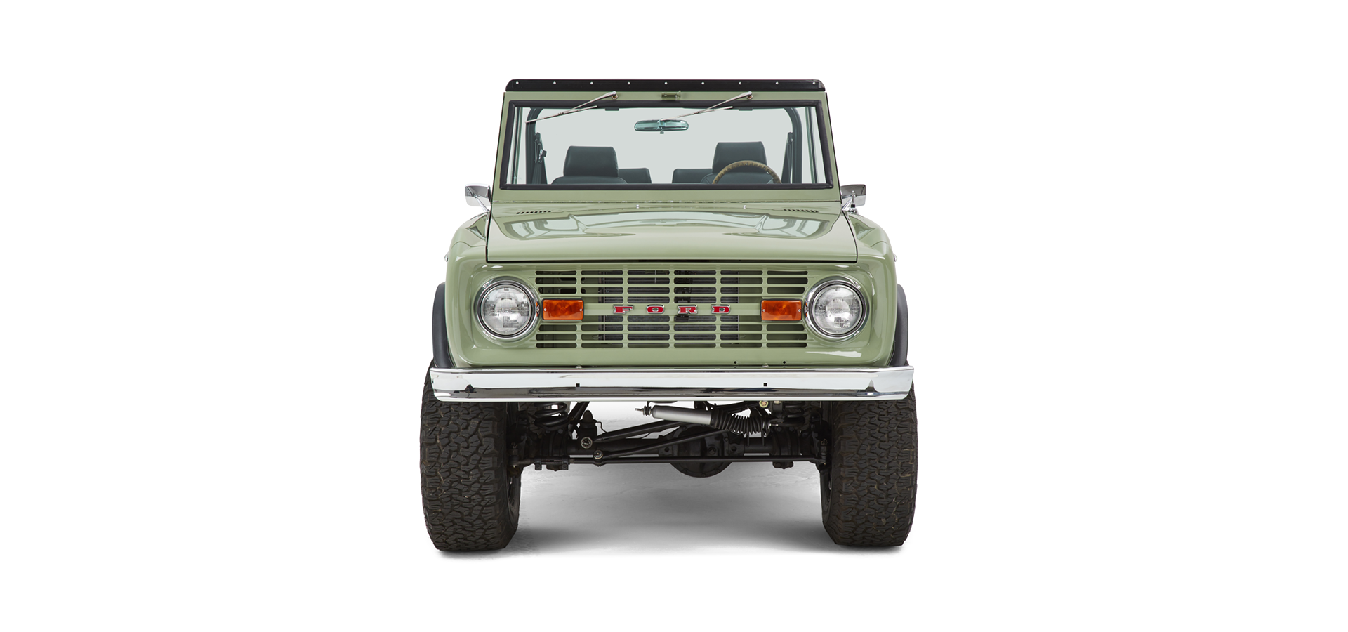 Classic Ford Bronco front view in green with chrome bumper and round headlights