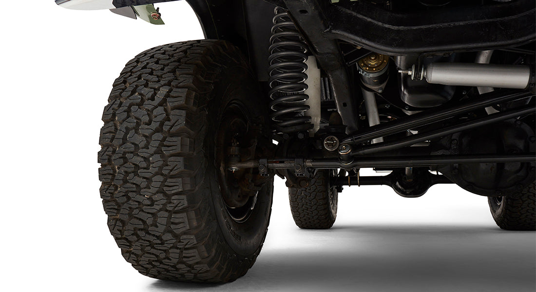 Underside close-up of Classic Ford Bronco rear suspension and tire tread