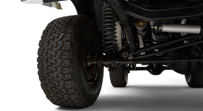 Underside close-up of Classic Ford Bronco rear suspension and tire tread