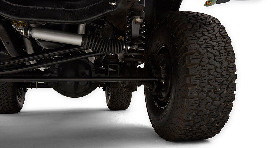 Underside close-up of Classic Ford Bronco front suspension and tire tread