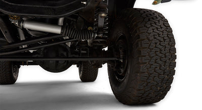 Underside close-up of Classic Ford Bronco front suspension and tire tread