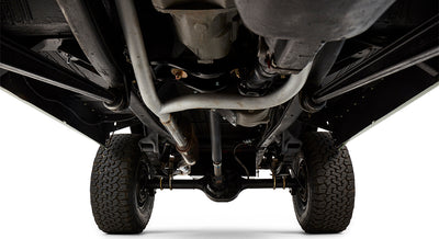 Underside of Classic Ford Bronco showing exhaust system, frame, and rear axle