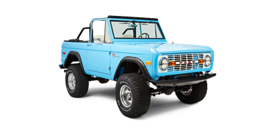 Front three-quarter view of a bright blue Classic Ford Bronco with lifted suspension.