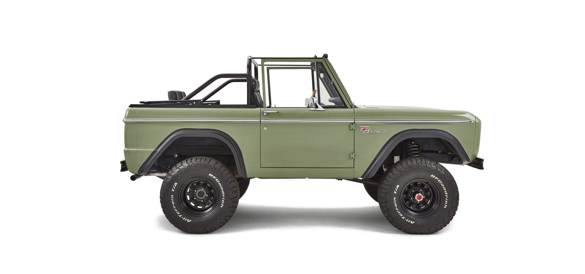Side profile of Classic Ford Bronco with green body, black wheels, and roll bar