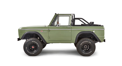 Green front grille of Classic Ford Bronco showing FORD letters and amber turn signals