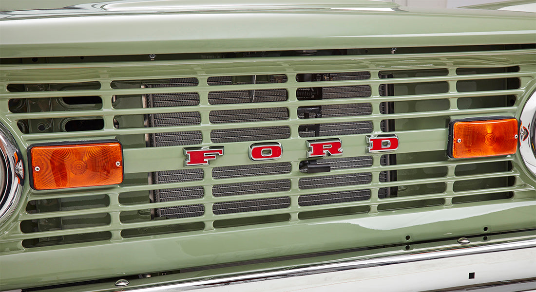 Green exterior side panel of Classic Ford Bronco with Sport Bronco emblem