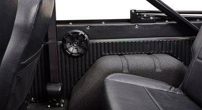 Close-up front view of Classic Ford Bronco grille and front tires with visible suspension