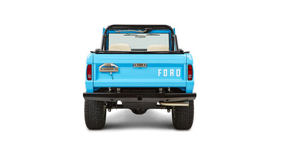 Rear view of blue Classic Ford Bronco showing tailgate closed with large FORD letters