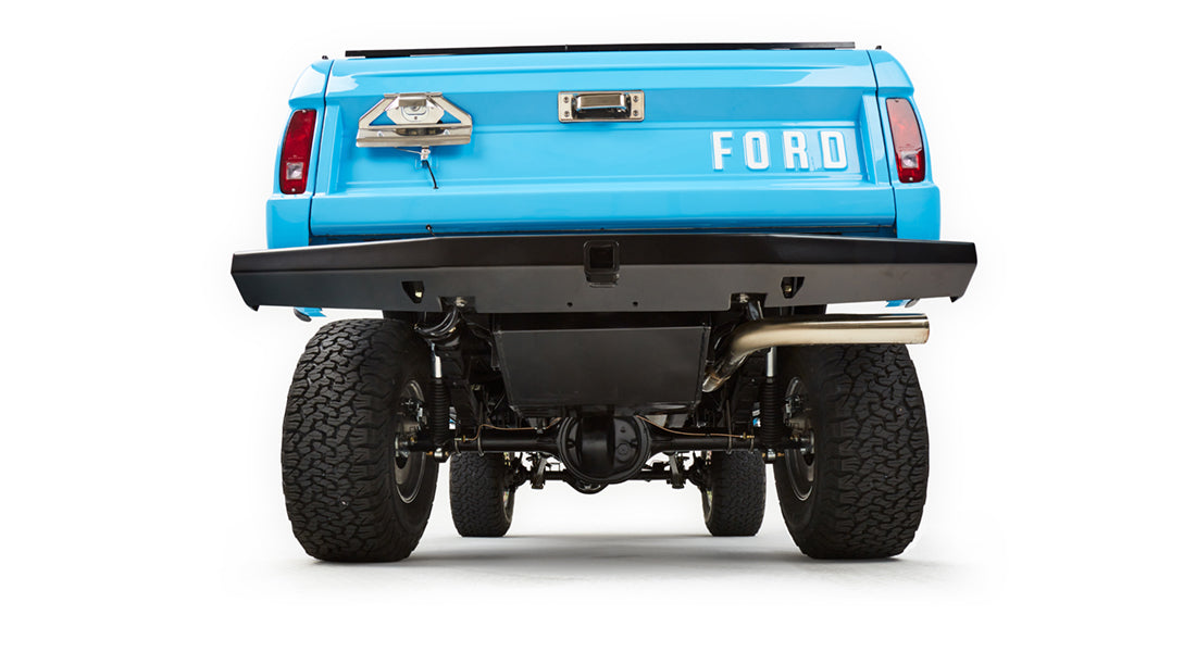 Underneath rear view of Classic Ford Bronco showing suspension, differential, and exhaust pipe