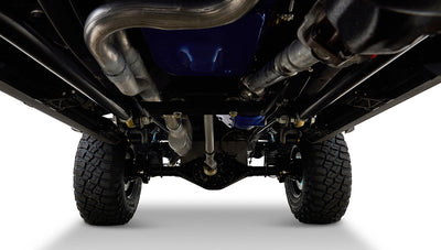 Undercarriage view of Classic Ford Bronco showing suspension components and tires.