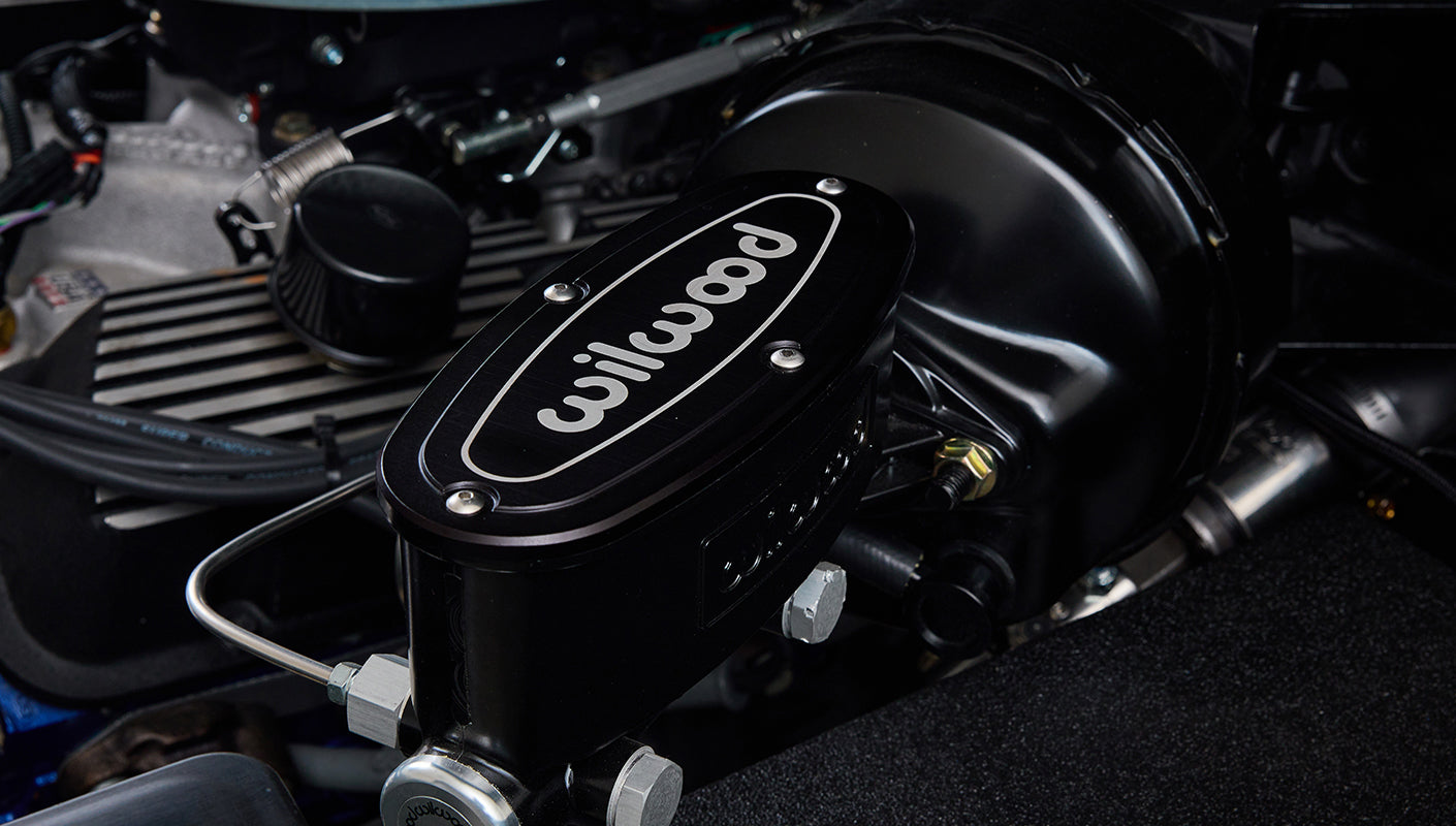 Close-up of black Wilwood component inside the engine bay of Classic Ford Bronco