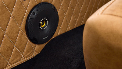 Brown leather front seats with textured and stitched details inside Classic Ford Bronco