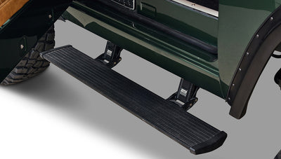 Black rugged step and portion of rear tire on Classic Ford Bronco in dark forest green