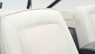 Close-up of white upholstery on a seat inside Classic Ford Bronco