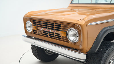 Front grill and headlights of a Classic Ford Bronco in Saddle Bronze color