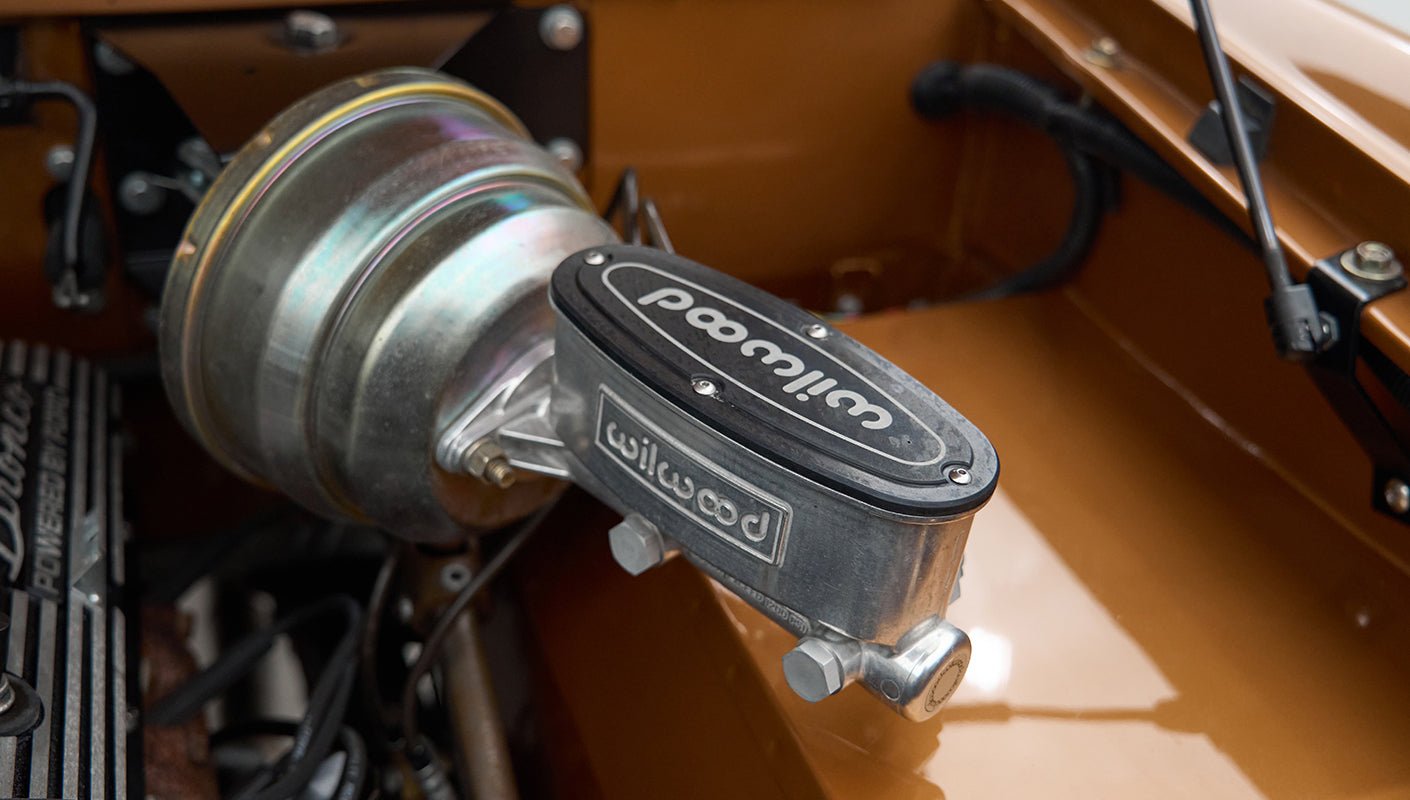 Close-up detail of Wilwood brake master cylinder in the engine bay of Classic Ford Bronco