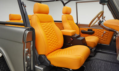 1972 classic ford bronco in matte silver over orange leather interior coyote series passenger interior
