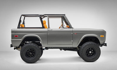 1972 classic ford bronco in matte silver over orange leather interior coyote series passenger side profile