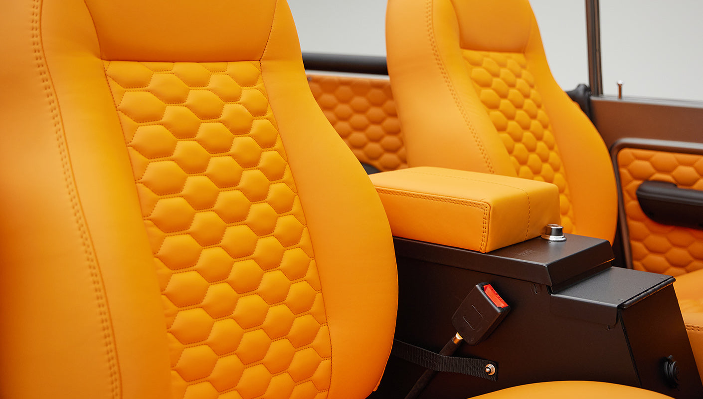 1972 classic ford bronco in matte silver with orange leather interior detail