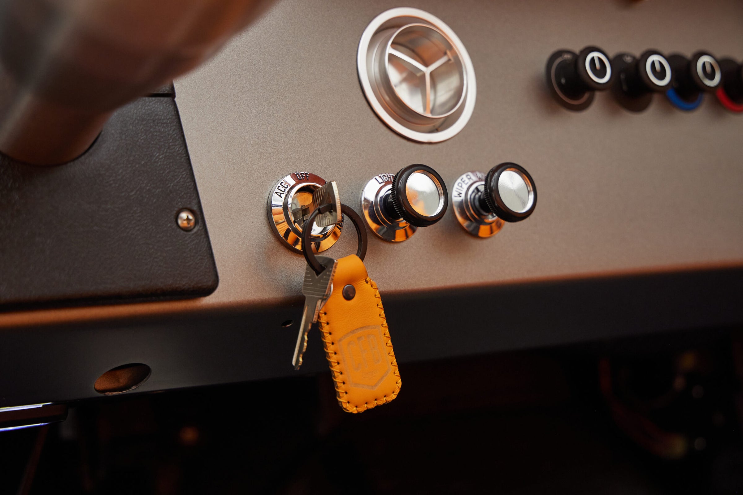 1972 classic ford bronco in matte silver with orange leather interior key