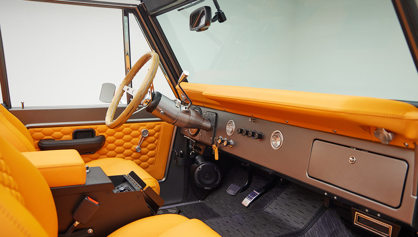 1972 classic ford bronco in matte silver with orange leather interior passenger dash