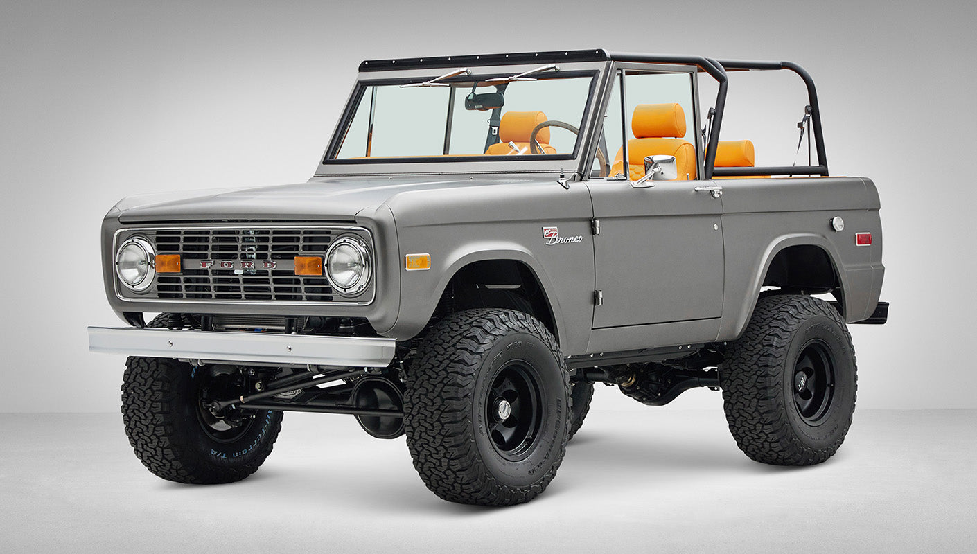 1972 Classic Ford Bronco in Matte Silver over Orange Leather interior front driver 3/4