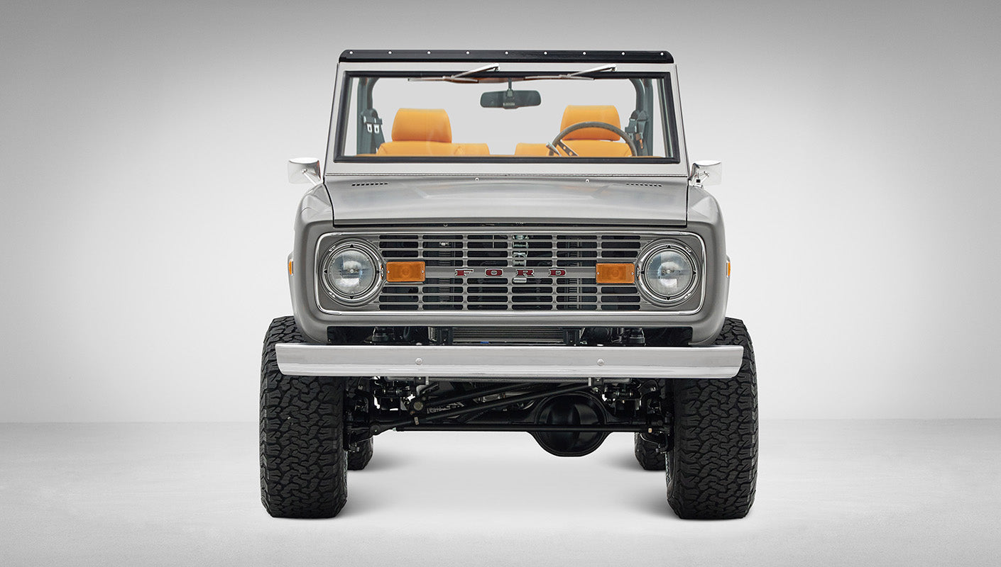 1972 Classic Ford Bronco in Matte Silver over Orange Leather interior front view