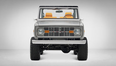 1972 Classic Ford Bronco in Matte Silver over Orange Leather interior front view