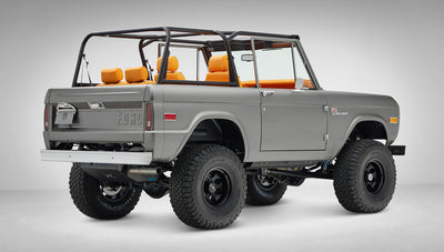 1972 Classic Ford Bronco in Matte Silver over Orange Leather interior rear passenger 3/4