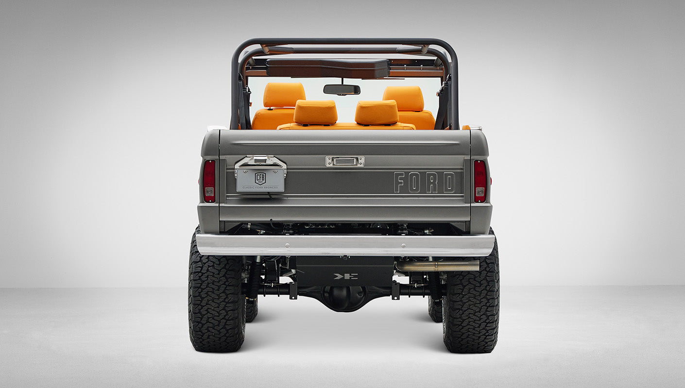 1972 Classic Ford Bronco in Matte Silver over Orange Leather interior rear end