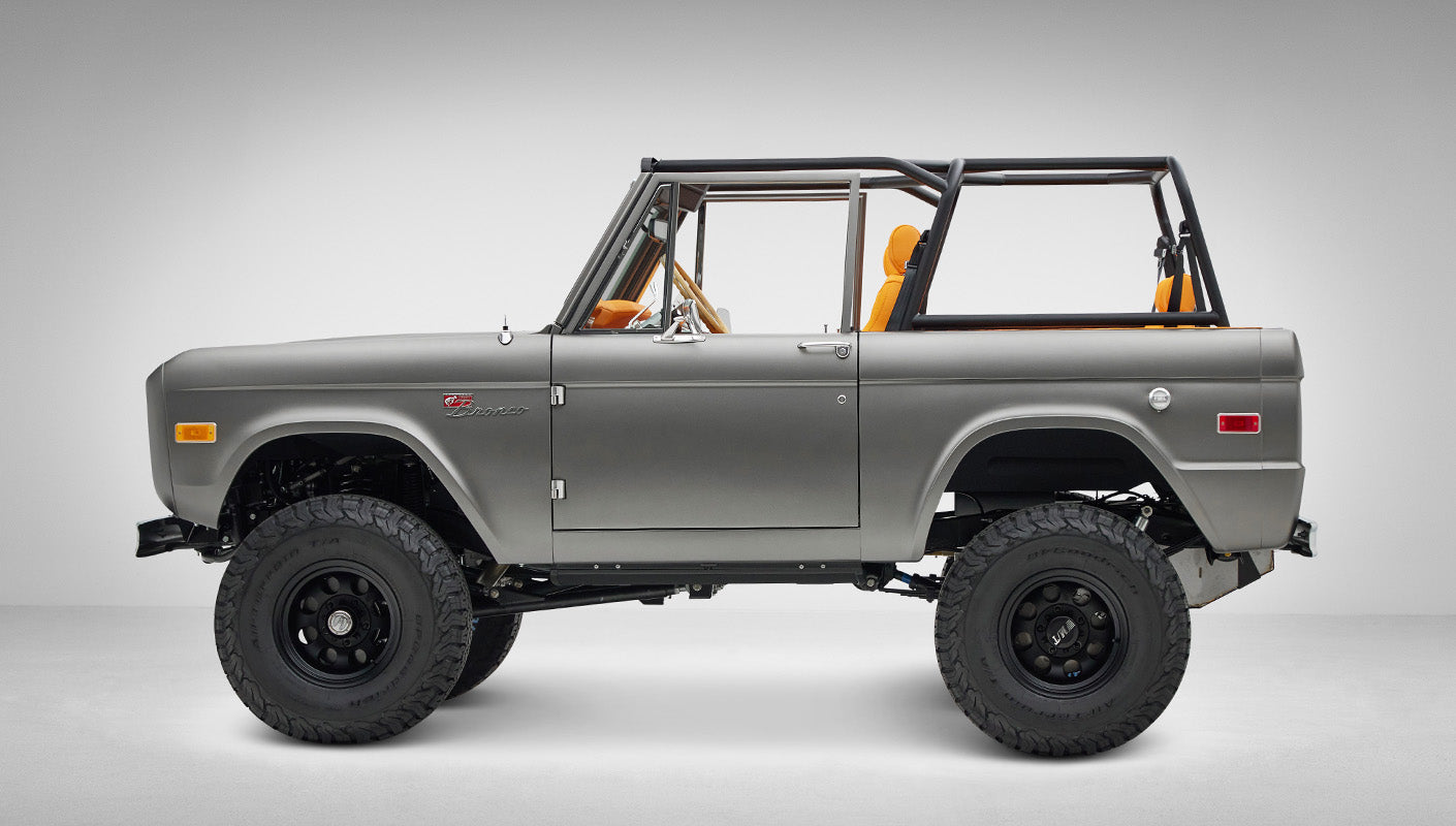 1972 Classic Ford Bronco in Matte Silver over Orange Leather interior driver side profile