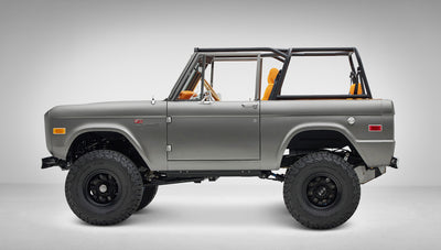 1972 Classic Ford Bronco in Matte Silver over Orange Leather interior driver side profile