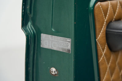 Information and emissions label sticker on green Ford Bronco door edge