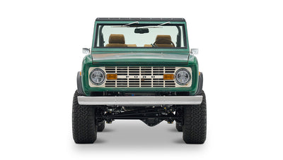 Classic Ford Bronco green with tan interior, left side profile on white background
