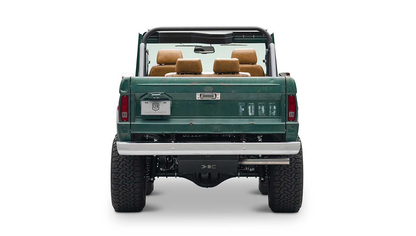 Classic Ford Bronco green, front view showing headlights and grill on white background