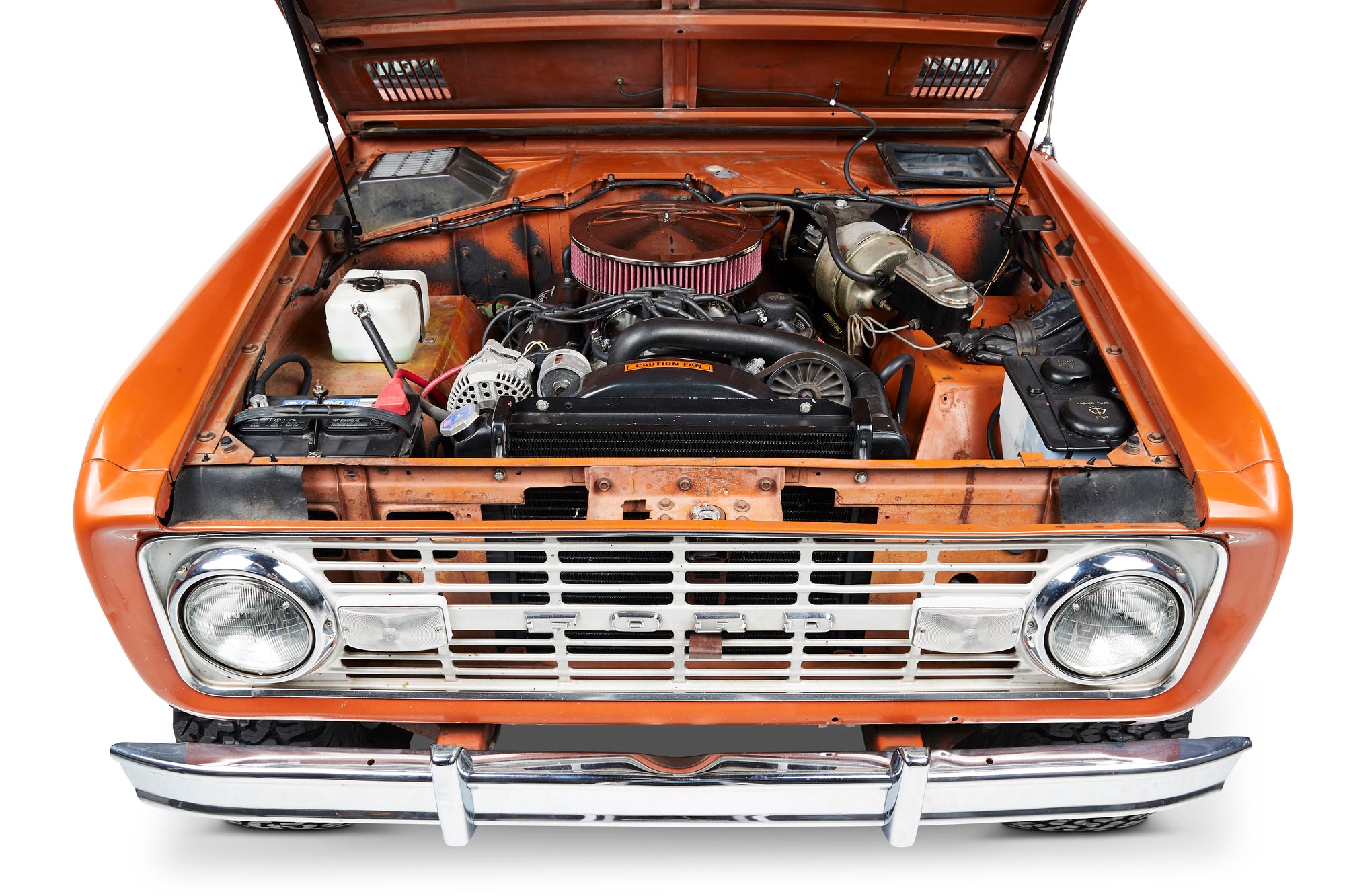Classic Ford Bronco front with open hood showing engine and orange body.