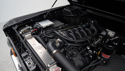 Close-up of steering components labeled PSC and Wilwood in engine compartment of Classic Ford Bronco
