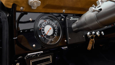 Dashboard speedometer and classic instrument panel with key fob on ignition in Classic Ford Bronco