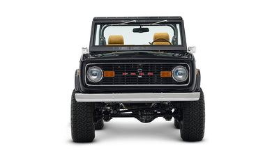 Front view of black Classic Ford Bronco with lifted suspension and chrome wheels