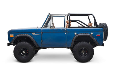 Side view of Classic Ford Bronco with open top and blue patina paint