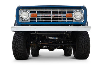 Front close-up showing grille, headlights, and tires of Classic Ford Bronco