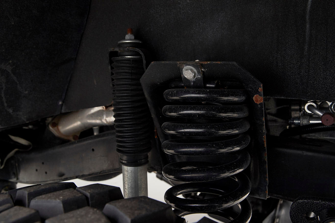 Close detail of suspension coil spring and shock absorber on Classic Ford Bronco